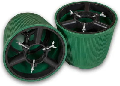 Two green Christmas tree stands are shown from a slightly elevated angle against a white background.