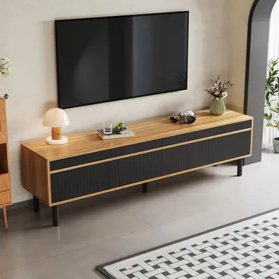 A modern living room with a TV stand and television.