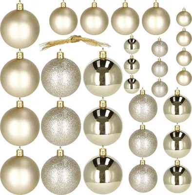 A collection of Christmas ornaments in various finishes and sizes arranged in rows on a white background.