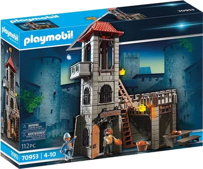 The image shows the packaging of a Playmobil castle tower playset, with the playset itself prominently displayed against a backdrop of a castle at night.
