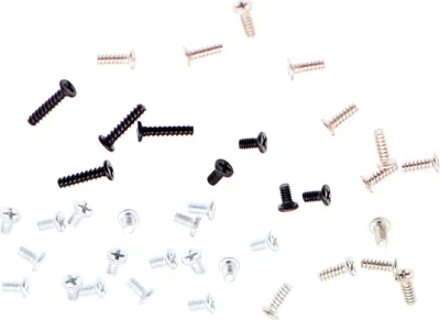 A collection of small screws scattered on a white background.