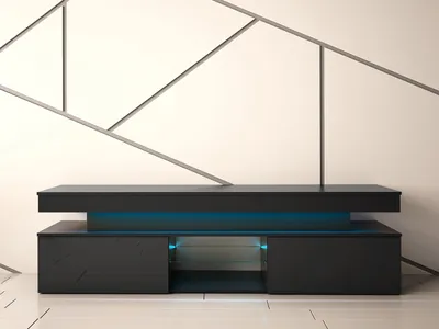 A modern black TV stand with blue LED lighting against a white wall with geometric metal accents.