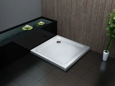 A modern bathroom with a shower tray, a water feature with lily pads, and bamboo plants.