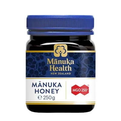 A jar of Manuka Health MGO 250+ Manuka Honey on a white background.