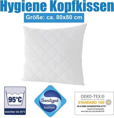 A white quilted pillow is shown with various certification and care labels at the bottom.