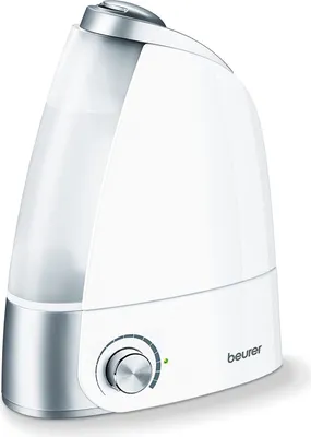 A white and silver humidifier on a white background.
