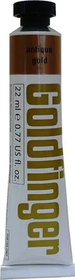 A tube of Daler Rowney Goldfinger paint in 'Antique Gold' color.