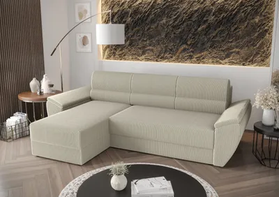 A beige sectional sofa with a chaise lounge is shown in a living room setting.