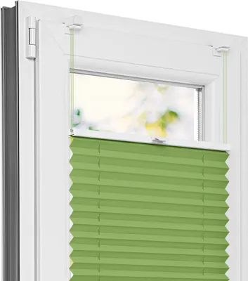 A close-up view of a green pleated blind installed on a white window frame.