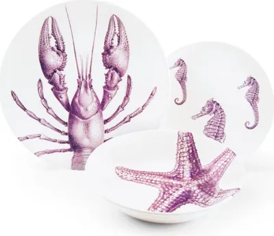 A set of three ceramic plates and bowls with marine life illustrations.