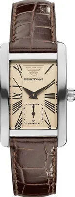 A rectangular watch with a brown leather strap and a beige dial with Roman numerals.