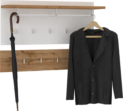 A black umbrella and a black jacket are displayed on a white and wood coat rack.