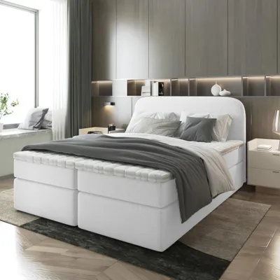 A bedroom scene featuring a bed.