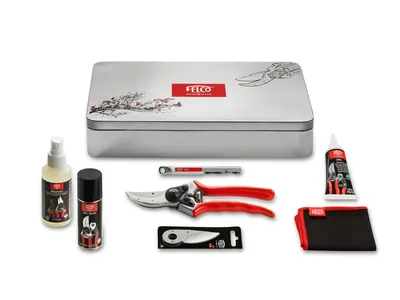 A set of gardening tools and maintenance supplies arranged on a white background.