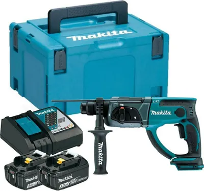 A Makita rotary hammer drill kit with batteries, charger, and storage case.