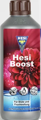 A bottle of HESI Boost plant fertilizer with a floral design.