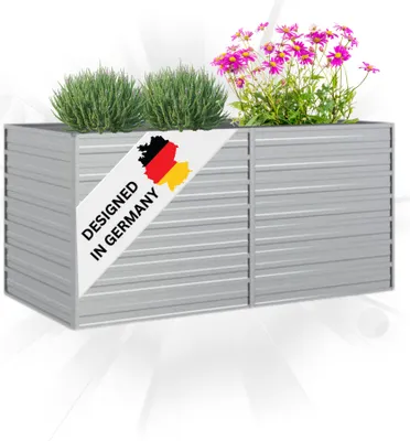 A silver rectangular planter box filled with green plants and pink flowers, with a diagonal banner indicating "DESIGNED IN GERMANY".