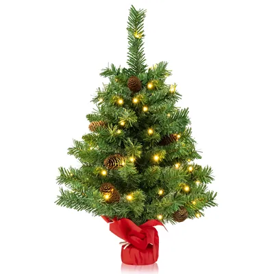 A small, pre-lit artificial Christmas tree decorated with pine cones and a red bow at its base, presented on a white background.