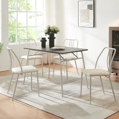 A dining set with a rectangular table and four chairs in a well-lit room.