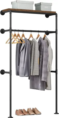 A clothing rack with shelves and hanging clothes, with shoes on the bottom shelf.