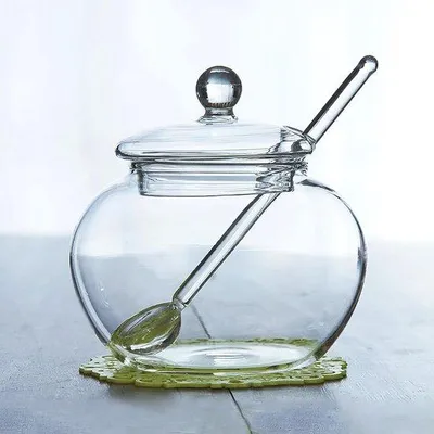 Produktbild von Gläserner Zuckerbehälter mit Löffel und Deckel für Küchenlagerung - Durchsichtig - 250 ML