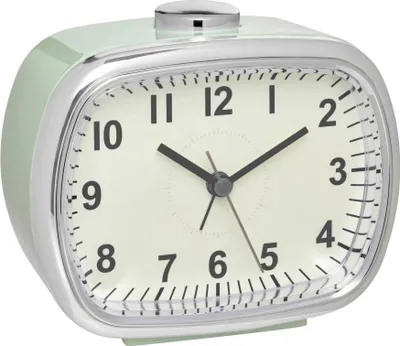 A mint green analog alarm clock with a silver frame, shown from a diagonal angle against a white background.