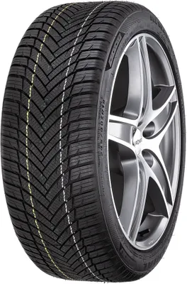 A close-up studio shot of a car tire mounted on a silver alloy wheel.