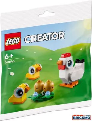 A LEGO Creator set featuring chickens and eggs on a green, hilly background.