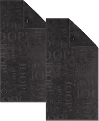 Two dark gray towels with a repeating brand logo pattern are laid out on a white background.