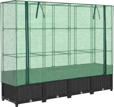 A greenhouse cover over a raised garden bed.