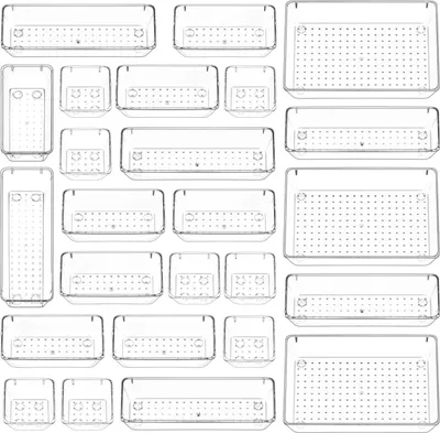 A collection of clear plastic storage containers of various sizes and shapes arranged in a grid pattern.