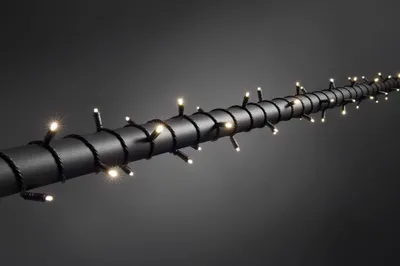 Produktbild von Konstsmide - Micro LED Lichterkette, mit 9h Timer, schutzisoliert/umgossen, IP67, 40 warm weiße Dioden, 24V Außentrafo, schwarzes Soft-Kabel ; 6630-117