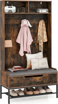 A rustic-style hall tree with a bench, storage compartments, hooks, and a shoe rack, decorated with a pink hooded towel, a scarf, and pillows.