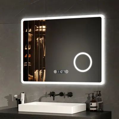A modern bathroom vanity with a rectangular LED mirror above a white sink.