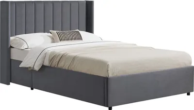 A dark gray upholstered bed with a tall, tufted headboard and a storage base, shown with white bedding and a decorative pillow.