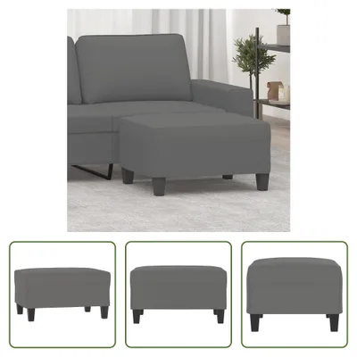 A close-up view of a dark gray ottoman, part of a sectional sofa, placed on a light gray carpet. The ottoman has four dark wooden legs.