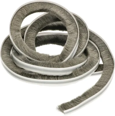 A coiled strip of weather stripping with bristles.