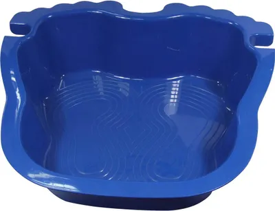 A blue foot bath with textured interior.