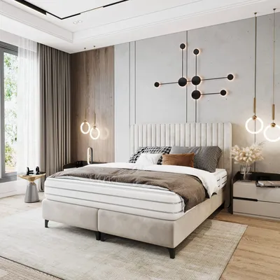 A modern bedroom with a large bed, bedside table, and window.