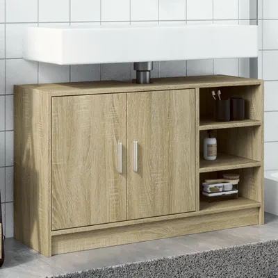 A bathroom vanity cabinet with a sink mounted on top, set against a tiled wall.