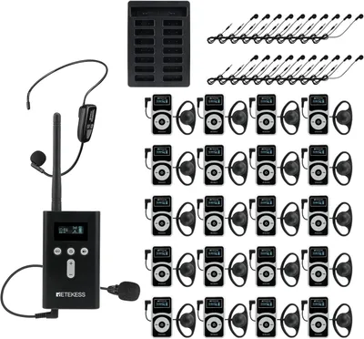 A collection of audio tour guide system components, including a base station, multiple receivers with earbuds, and charging accessories, arranged on a white background.