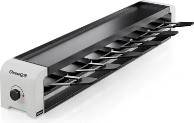 A white and black electric raclette grill with multiple spatulas.