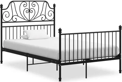 A black metal bed frame with a mattress and a white pillow against a white background.