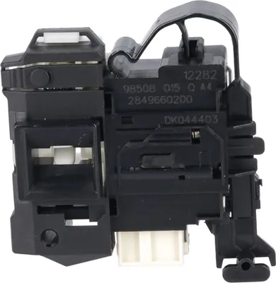 A black and white plastic component with various connectors and markings.