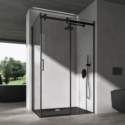 A modern bathroom with a black framed glass shower enclosure.