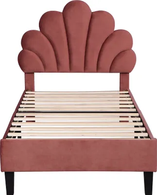 A pink upholstered bed frame with a seashell-shaped headboard and a wooden slat mattress support is shown against a white background.
