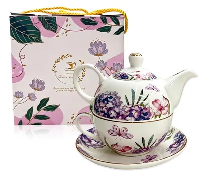 Imagen del producto de Tetera de cerámica creativa con taza y platillo