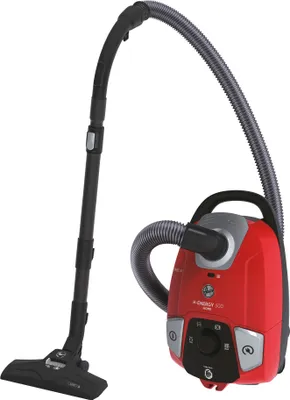A red and gray vacuum cleaner with its hose and wand detached.