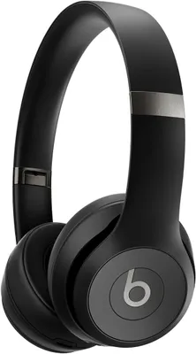 A pair of black Beats headphones is shown against a white background.