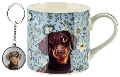 Imagen del producto de Recipiente Noya Kubek Z Breloczkiem, 380 ml, 9 x 13 x 9 cm, diseño "Teckel" (perro salchicha)